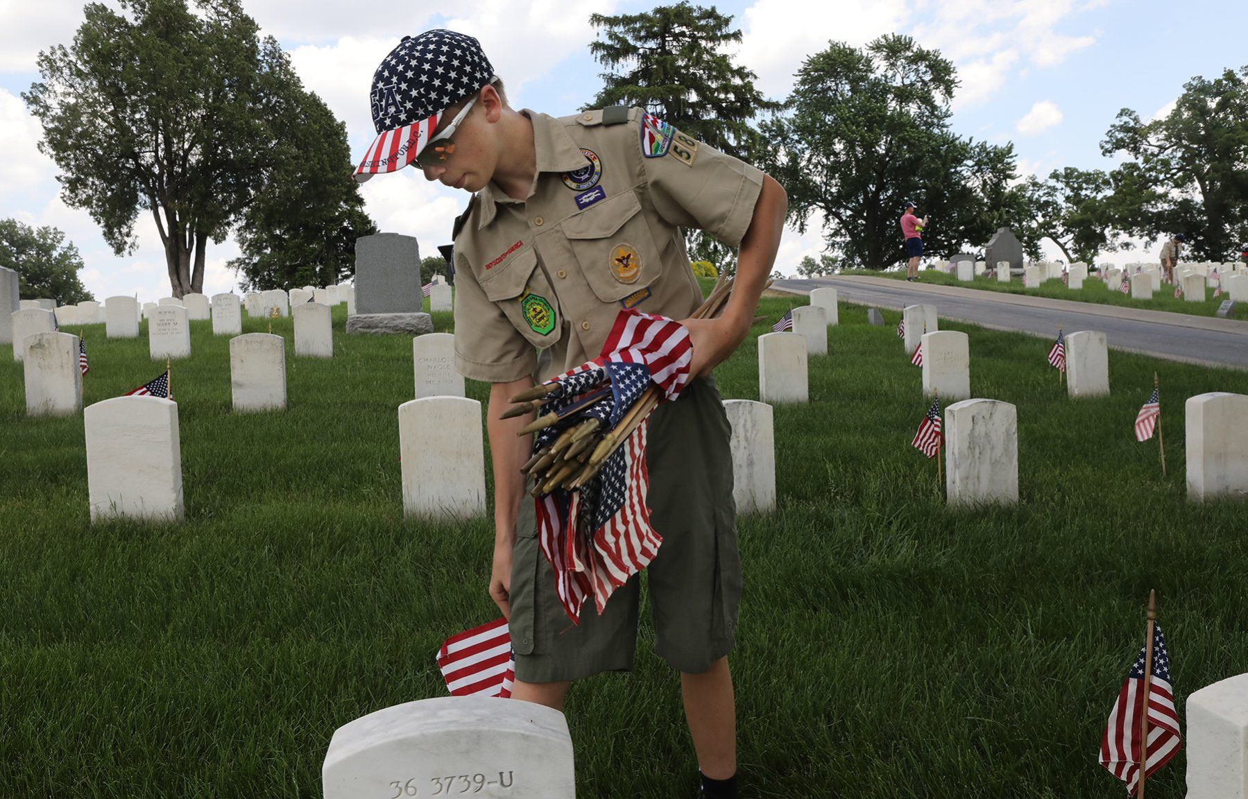 Scouts place flags in Jefferson Barracks for Memorial Day
